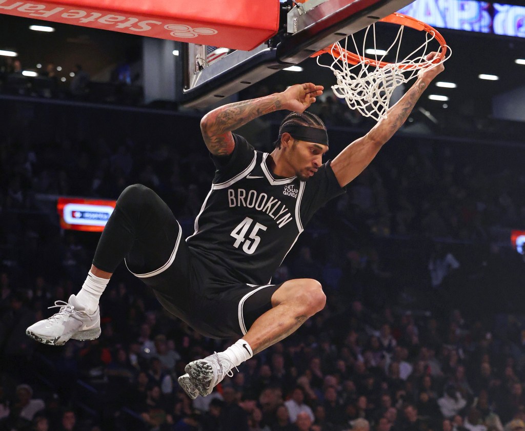 Keon Johnson #45 of the Brooklyn Nets dunking.