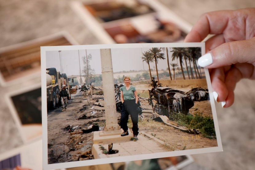 Sarah Dodd shows a 2003 photo at her home, Wednesday, Aug. 6, 2025, in Dallas. It was taken...