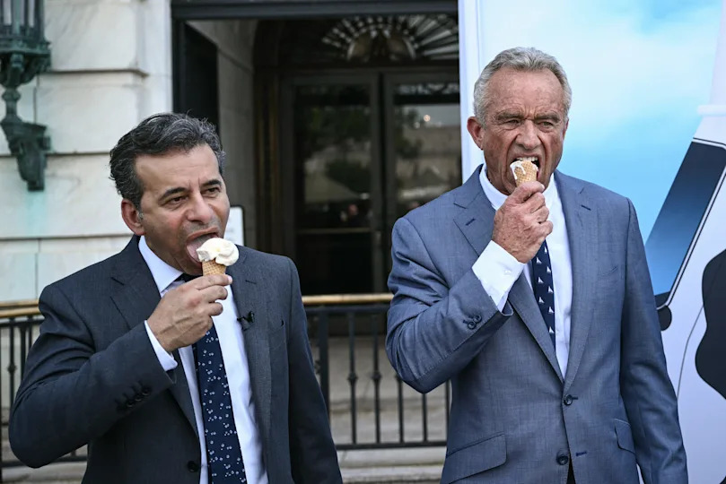 Food and Drug Administration Commissioner Martin Makary and Secretary of Health and Human Services Robert F. Kennedy Jr., eat ice cream at the end of a news conference at the USDA headquarters building in Washington, DC, on July 14, 2025.