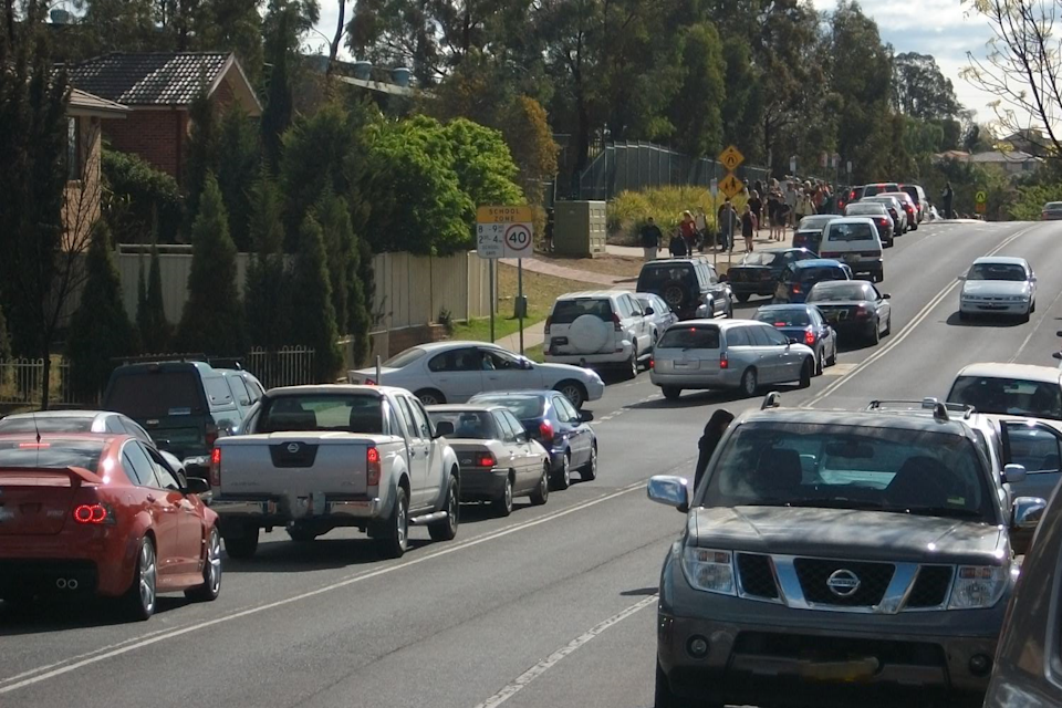 Traffic flows along a busy street. 