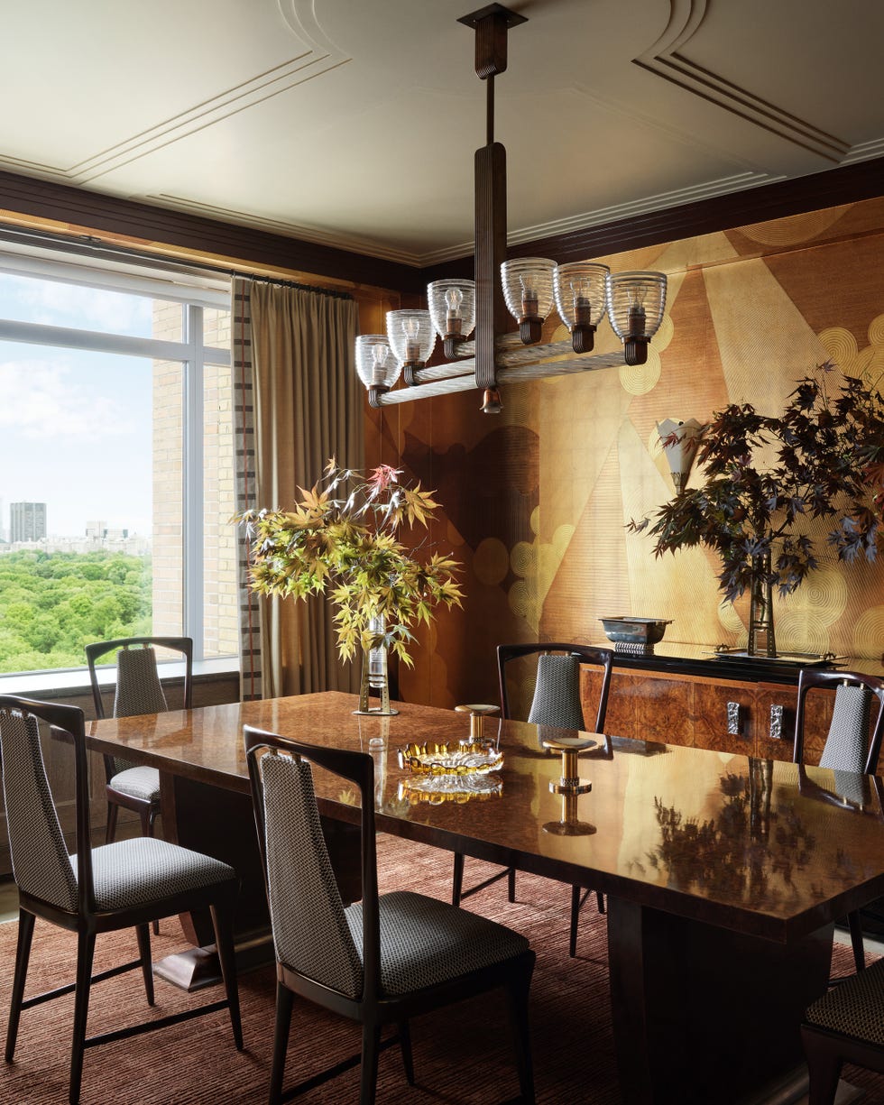 Elegant dining area with a wooden table, chairs, and decorative elements.