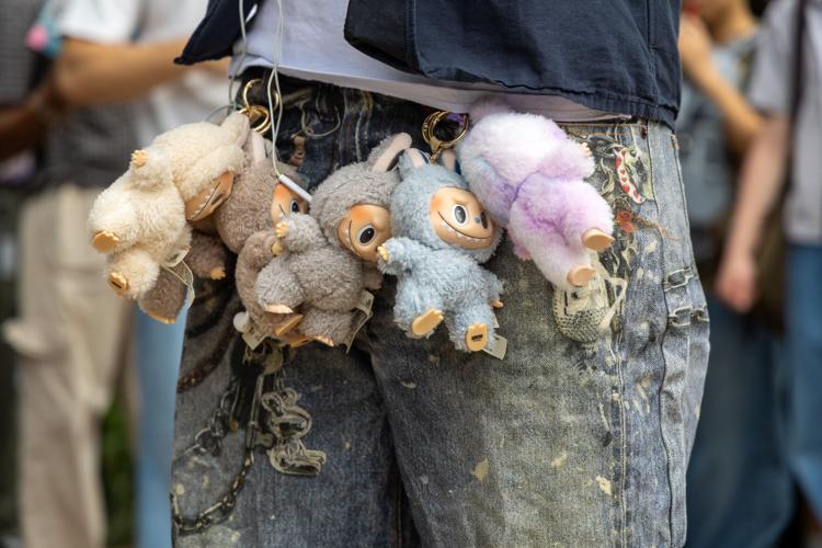 Nursing junior Christopher Yon wears multiple Labubu keychains on his pants during a performative male contest Sept. 24 at Central Library mall.