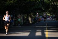 Pedestrians jog and walk along Katy Trail near Uptown on Aug. 16 in Dallas. With planners...