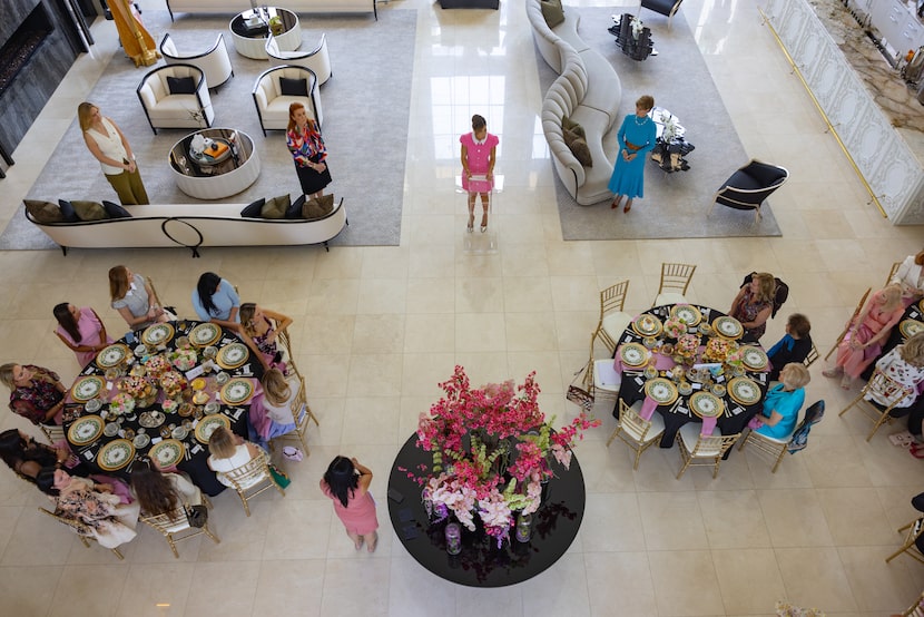 Nikki Ramji, owner of the Preston Hollow home where a High Tea was held, stands in the...