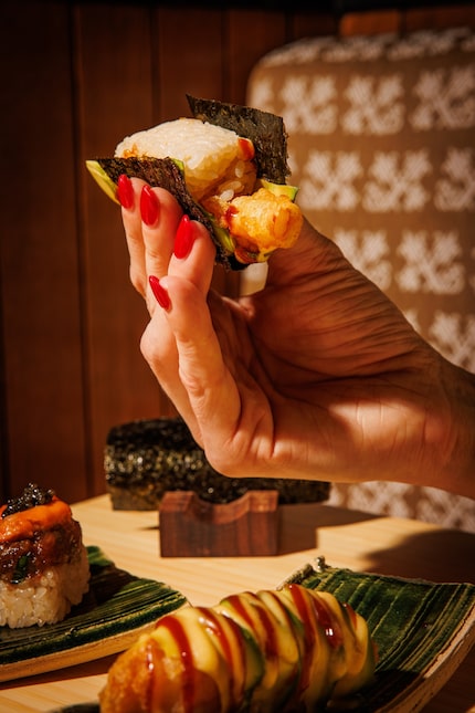 Norman's Japanese Grill serves shrimp tempura handrolls with beef-bacon mayo in a...