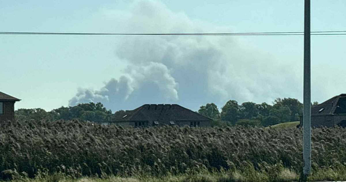 Large auto lot fire burning in Chicago Heights, Illinois