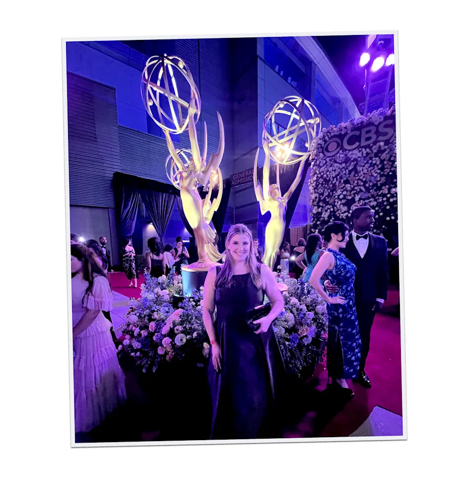 Kelly poses by a display inside the Emmys.