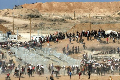 Palestinians seek aid at a Gaza Humanitarian Foundation site, in August.
