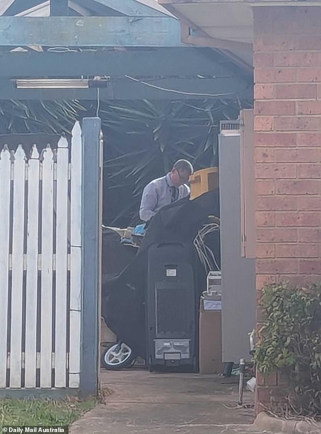 Forensic police were seen combing through debris outside the home after they joined fire investigators and Victoria Police's Arson Squad at the scene
