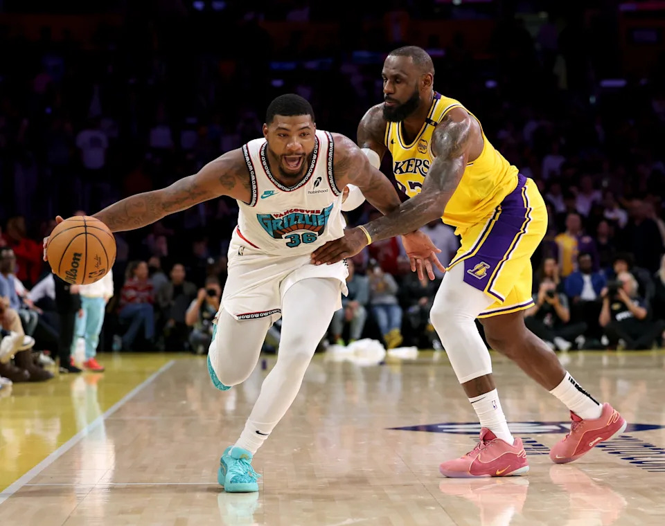 LOS ANGELES, CALIFORNIA - NOVEMBER 13: Marcus Smart #36 of the Memphis Grizzlies reacts as he is fouled by LeBron James #23 of the Los Angeles Lakers during a 128-123 Lakers win at Crypto.com Arena on November 13, 2024 in Los Angeles, California. (Photo by Harry How/Getty Images) NOTE TO USER: User expressly acknowledges and agrees that, by downloading and or using this photograph, User is consenting to the terms and conditions of the Getty Images License Agreement. (Photo by Harry How/Getty Images)