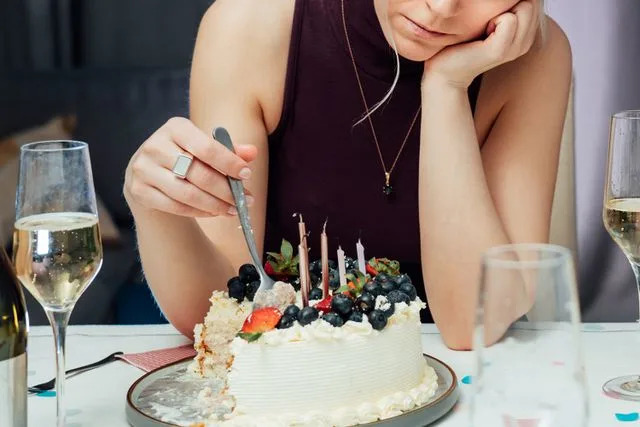 Getty Images Stock photo of a woman upset for her birthday