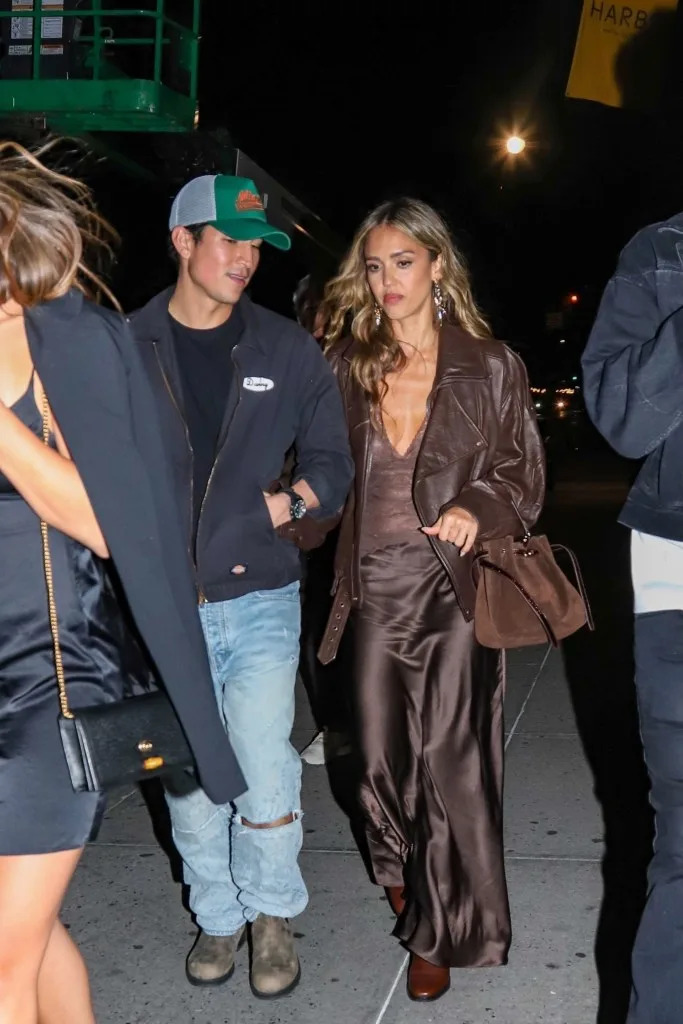 Alba wore a brown halter top and matching satin maxi skirt for the outing. Alessandra G / BACKGRID