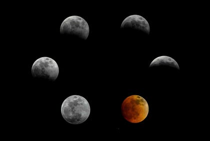 This combination of pictures created shows the stages of the total lunar eclipse, also known as the "Blood Moon."