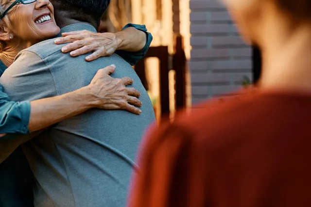 Getty Images Stock photo of a mom embracing her son-in-law