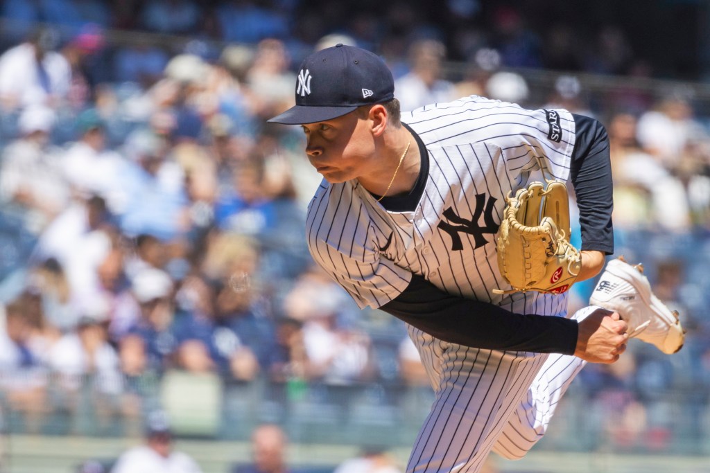 New York Yankees pitcher throwing a pitch.