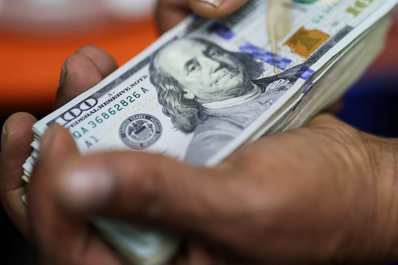 Dollar soft on US shutdown worries, Aussie perks up after RBA