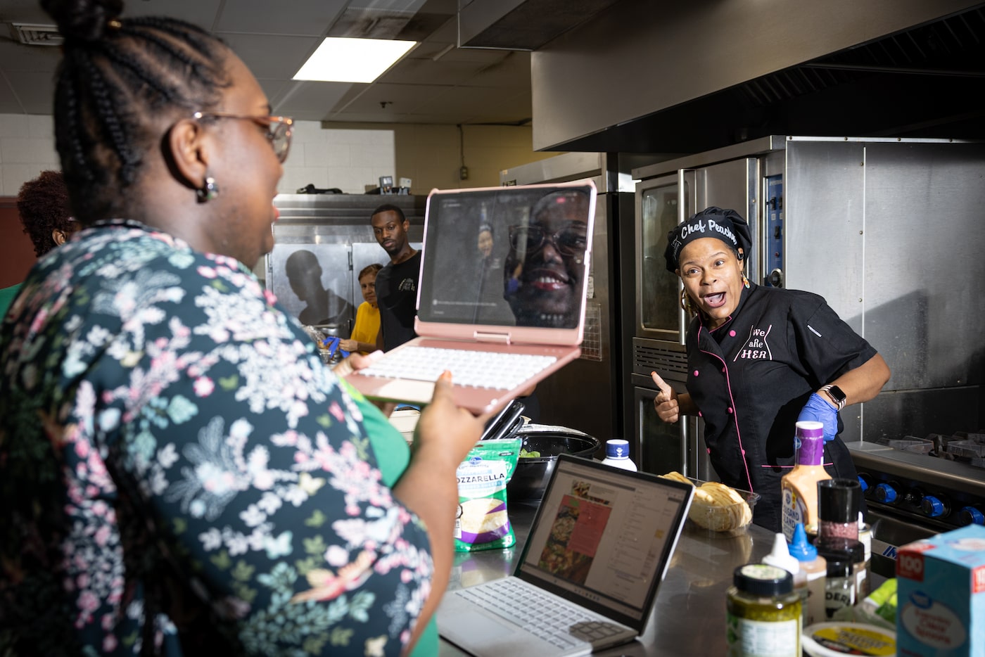 Grocery Connect Concierge Kenedi Houston takes a live video of Latasha Cummings, or “Chef...