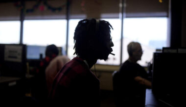 Customer Experience Representative Rico Thomas takes calls at an Alorica center, Monday, Aug. 19, 2024, in San Antonio. (AP Photo/Eric Gay)