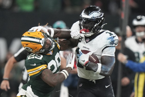 Philadelphia Eagles wide receiver A.J. Brown (11) push off Green Bay Packers safety Xavier McKinney (29) during the first half of an NFL football game, Friday, Sept. 6, 2024, at the Neo Quimica Arena in Sao Paulo. (AP Photo/Fernando Llano)