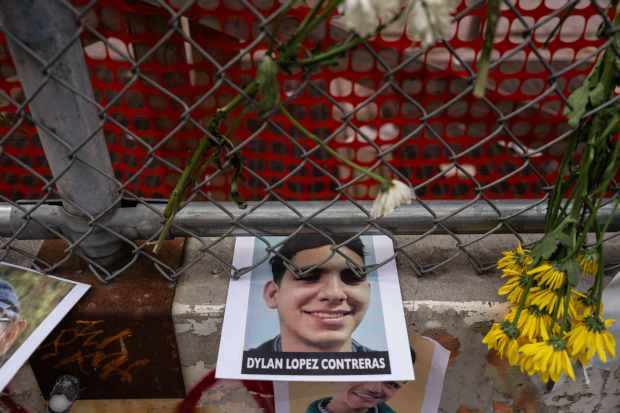 A picture of Dylan Lopez Contreras, a public high school student detained by federal agents, is displayed outside the Jacob K. Javits federal building, Friday, July 18, 2025, in New York. (AP Photo/Yuki Iwamura)