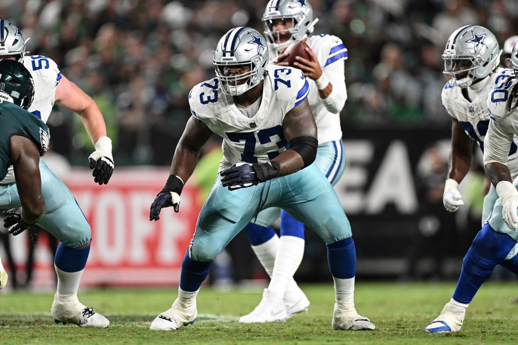 Dallas Cowboys guard Tyler Smith (73) prepares to block during the second half of an NFL football game against the Philadelphia Eagles, Thursday, Sept. 4, 2025, in Philadelphia.