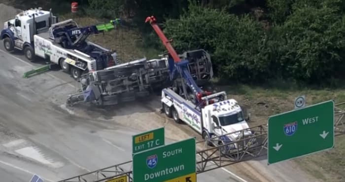 Truck hauling gravel overturns in crash, shutting down westbound lanes of I-610 at I-45