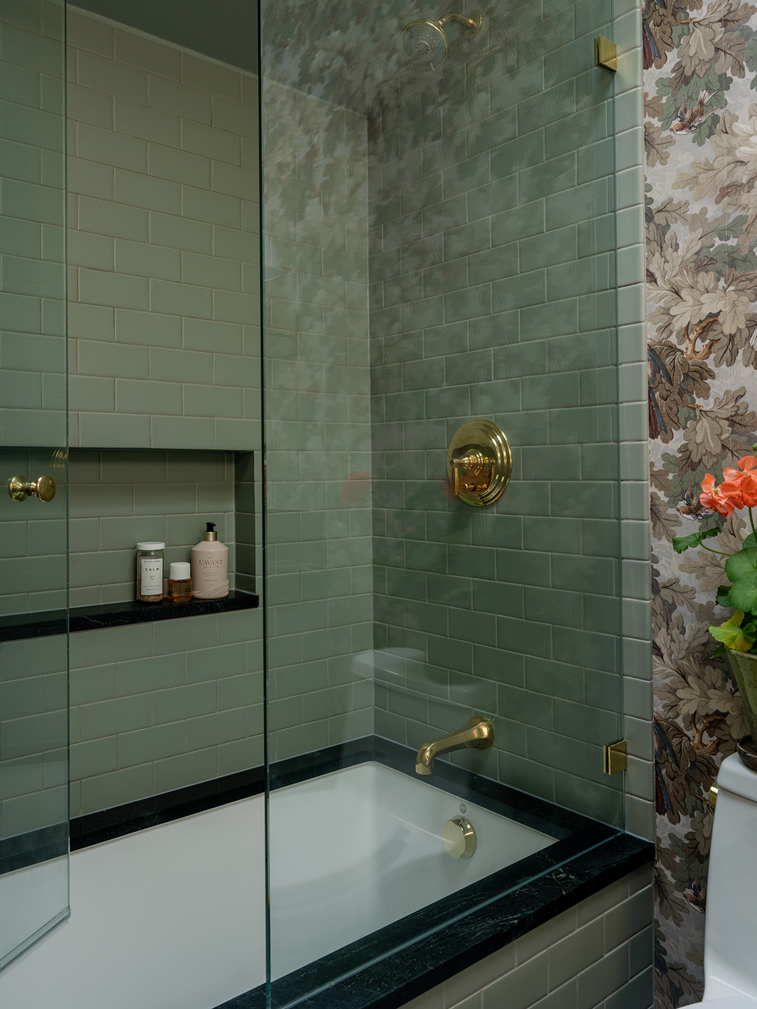 Green tiled tub and shower