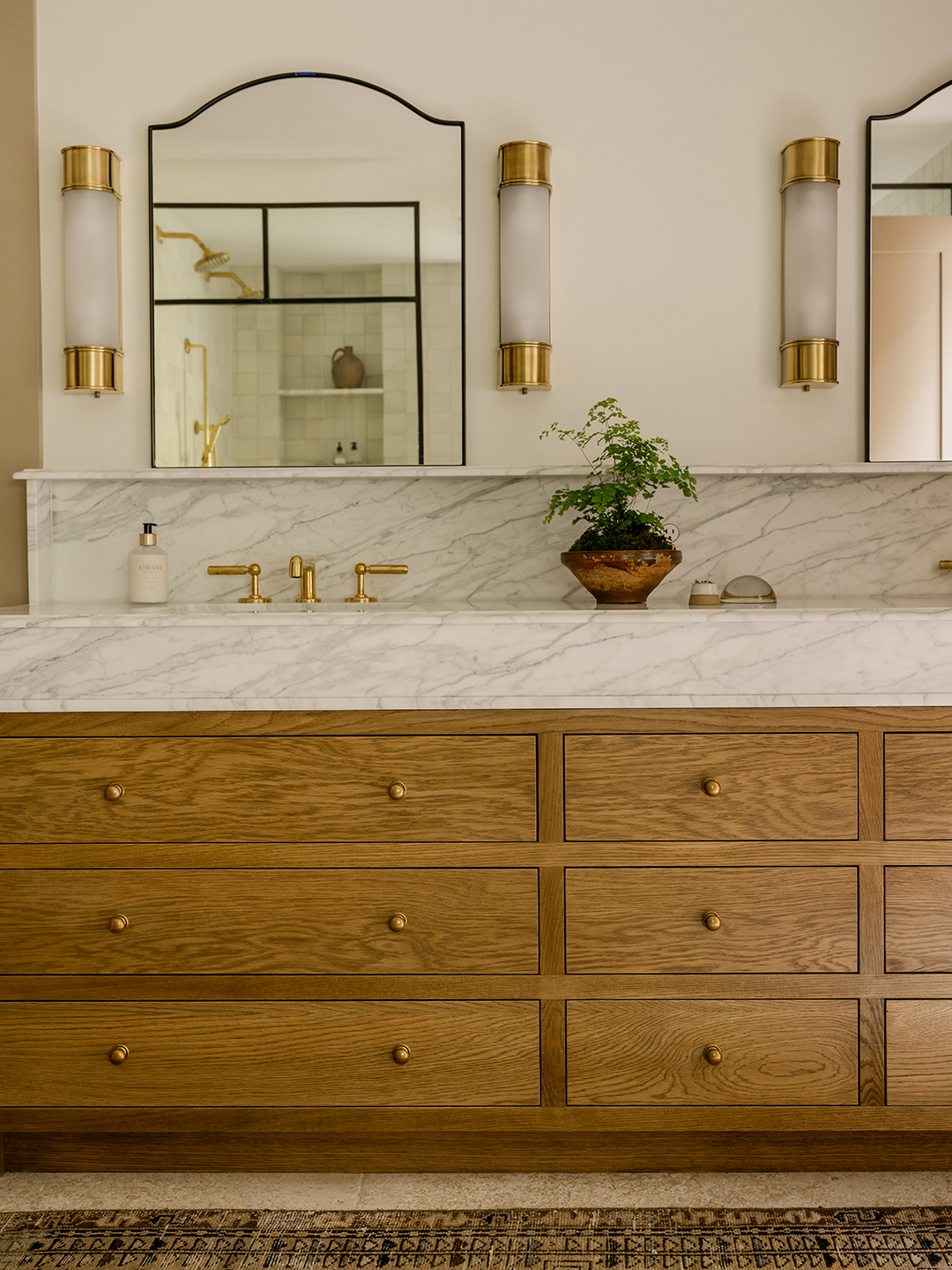 Wooden vanity with marble countertops