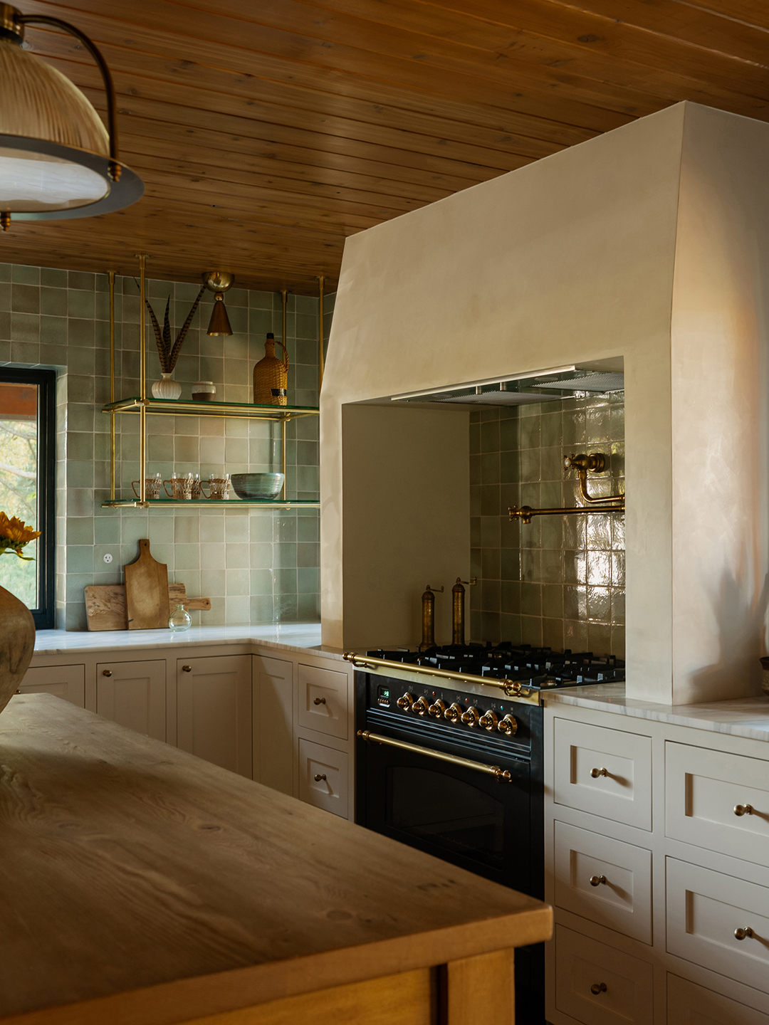 Black range with white plaster hood