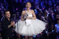 Christian Breslauer (left) and Ariana Grande accept the award for video of the year for...