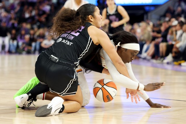 Golden State Valkyries' Veronica Burton (22) and Phoenix's Kahleah Copper (2) struggle for a loose ball in the fourth quarter of a WNBA game at Chase Center in San Francisco, Calif., on Tuesday, May 19, 2025. (Ray Chavez/Bay Area News Group)