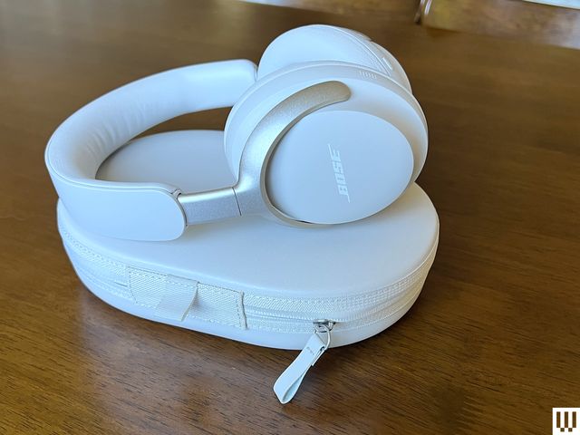 White Bose Noise Cancelling Wireless Headphones sitting atop carrying case 