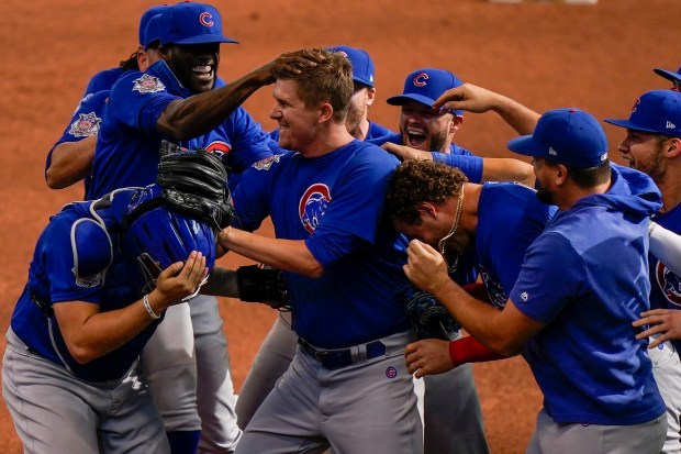 Chicago Cubs starting pitcher Alec Mills is swarmed by teammates after throwing a no hitter against the Milwaukee Brewers on Sept. 13, 2020, in Milwaukee. The Cubs won 12-0. (Morry Gash/AP)