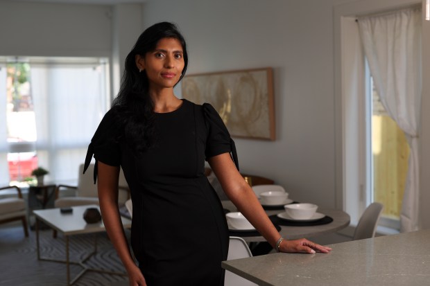 Ri Prasad, a real estate agent and developer, said property investors are flocking to neighborhoods such as Englewood, driving up property values. They have been spurred by various public development programs and Chicago's dwindling supply of affordable real estate, she said. (Eileen T. Meslar/Chicago Tribune)