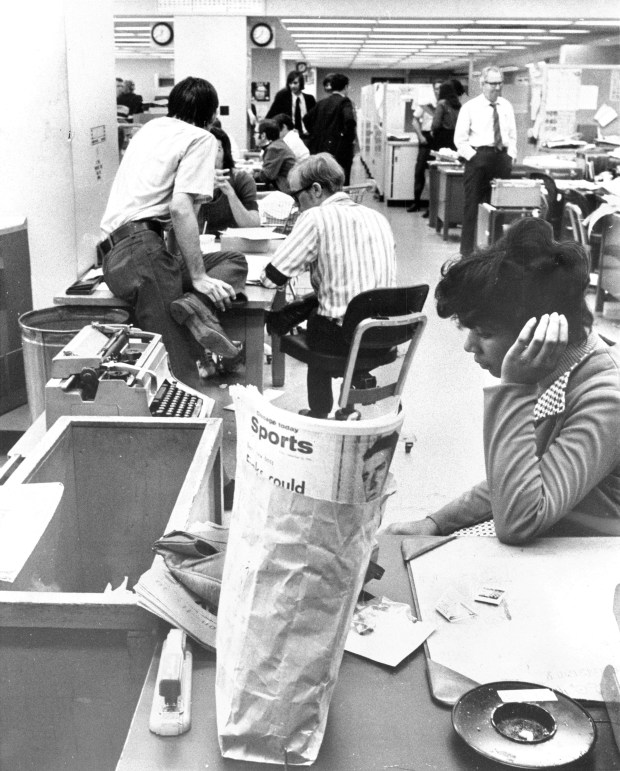 There was no joy in the Chicago Today city room on Sept. 13, 1974, the newspaper's last day of publication. A disconsolate Alice Neal sits at a desk in the foreground and considers the future. (Edward Wagner Jr./Chicago Tribune)