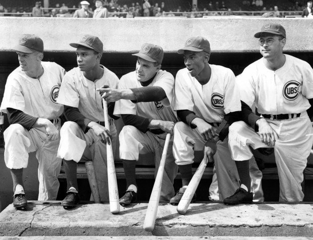 Chicago Cubs manager Phil Cavarretta, third from left, familiarizes Wrigley Field on Sept. 14, 1953, for recruits, left to right, outfielder Bob Talbot, shortstops Gene Baker and Ernie Banks and pitcher Bill Moisan. Talbot, Baker and Moisan played for the Los Angeles of the Pacific Coast league and Banks was a member of the Kansas City Monarchs of the Negro American league. (Chicago Tribune historical photo)