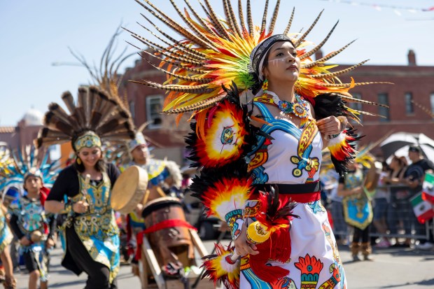 Aztec dancers lead the annual 26th Street Mexican Independence Day...