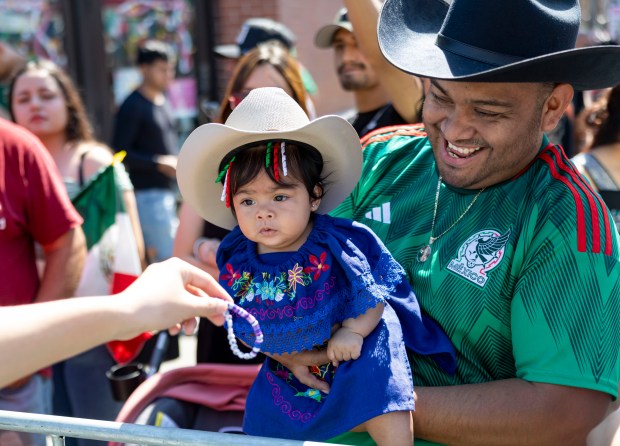 Óscar Gómez and his 5-month-old daughter, Ailini Celeste Gómez, get...
