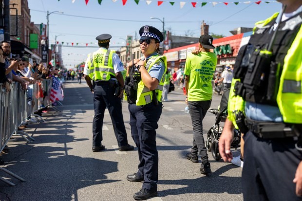 Chicago police monitor the annual 26th Street Mexican Independence Day...