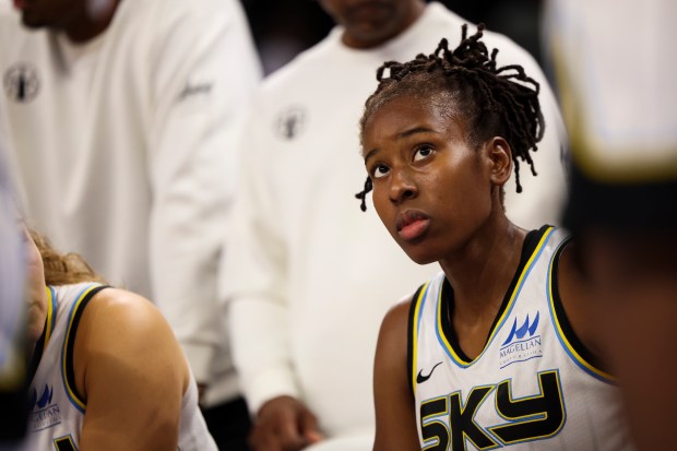 Sky guard Ariel Atkins sits on the bench during a huddle in a game against the Atlanta Dream on Aug. 7, 2025, at Wintrust Arena. (Eileen T. Meslar/Chicago Tribune)