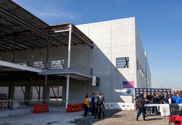 Chicago Sky and Bedford Park officials sign the final beam as they mark a construction milestone on their new practice facility Wednesday, Sept. 17, 2025, at the Wintrust Sports Complex. (Brian Cassella/Chicago Tribune)