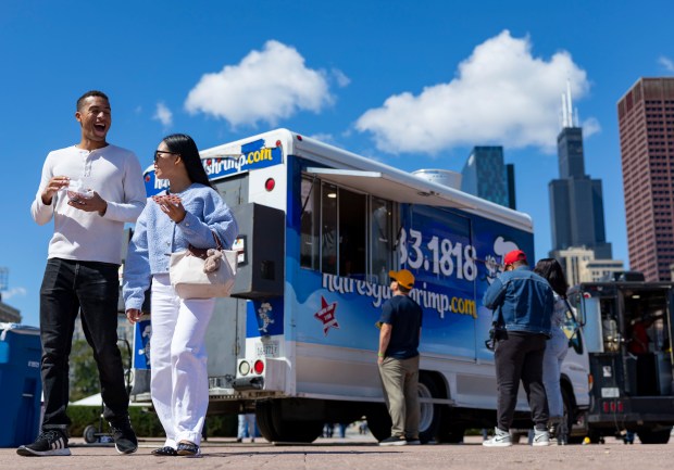 People order from food trucks near Buckingham Fountain on Sept. 7, 2025, during the Taste of Chicago in Grant Park. (Brian Cassella/Chicago Tribune)