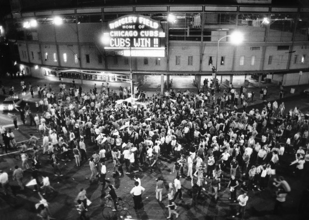 Fans swarmed to Wrigley Field to celebrate on Sept. 24, 1984, as the Cubs clinched the National League East title, even though the game was played in Pittsburgh. (Jerry Tomaselli/Chicago Tribune)
