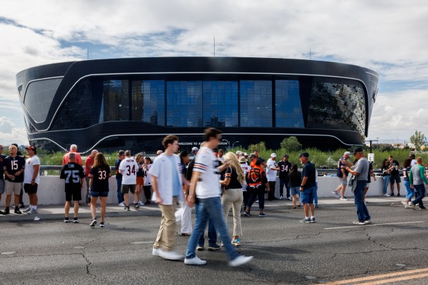 Bears and Raiders fans walk toward Allegiant Stadium before the game, Sept. 28, 2025, in Las Vegas. (Armando L. Sanchez/Chicago Tribune)