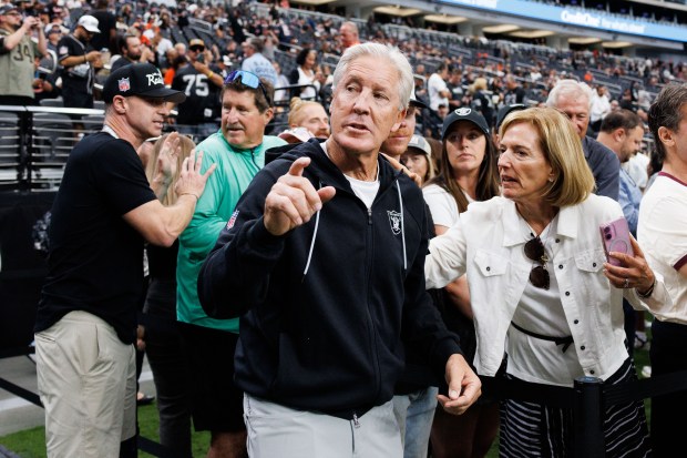 Las Vegas Raiders head coach Pete Carroll walks on the...