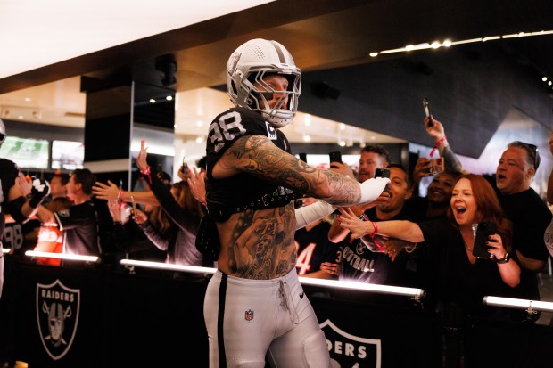 Las Vegas Raiders defensive end Maxx Crosby (98) walks to...