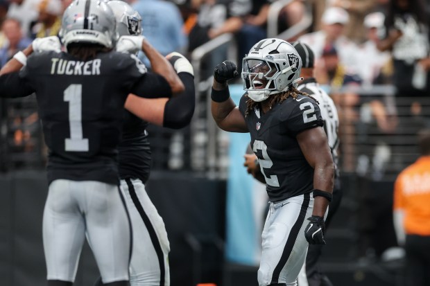 Las Vegas Raiders running back Ashton Jeanty (2) celebrates after...