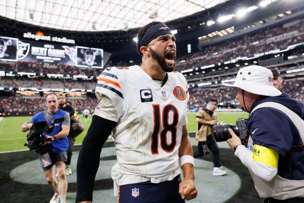 Chicago Bears quarterback Caleb Williams (18) celebrates after Chicago Bears...