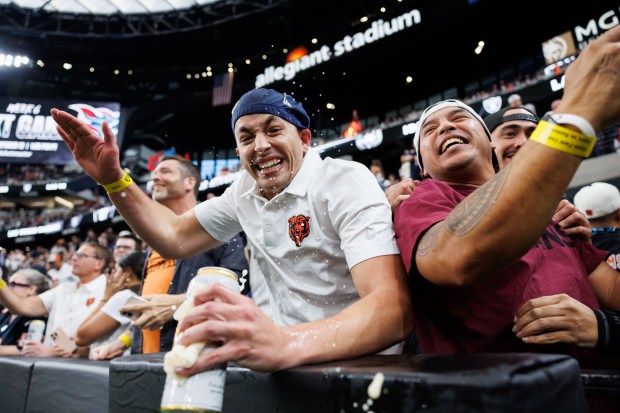 Fans celebrate after Chicago Bears cornerback Josh Blackwell (39) blocked...