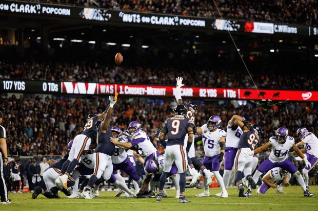Minnesota Vikings place kicker Will Reichard (16) kicks a field...